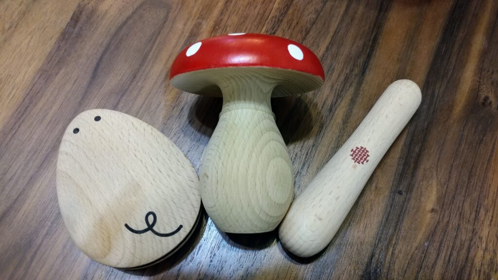 Three darning tools - a darning mouse, a darning mushroom, and a darning stick